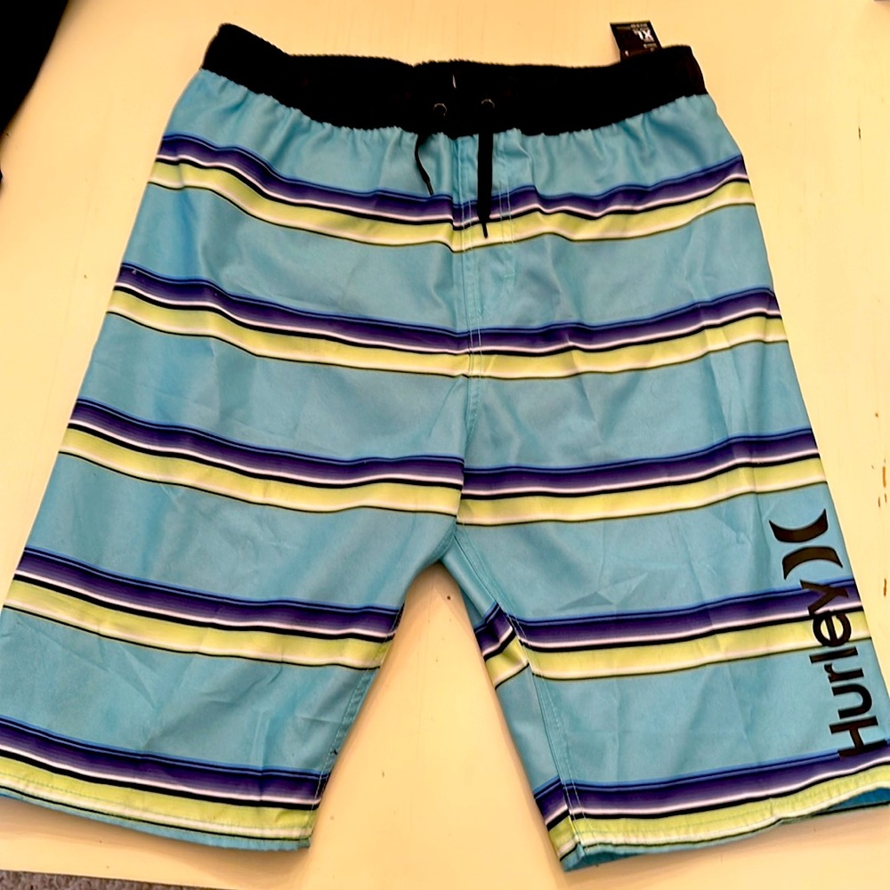 Hurley board shorts – tropical twist - new with tags. 13 to 15 years size